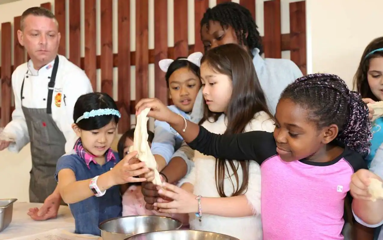 Children in Greek cooking workshop